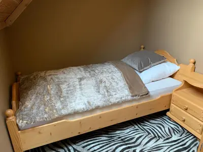 Ein Bett oder Betten in einem Zimmer der Unterkunft Ausseerhaus im Grünen
