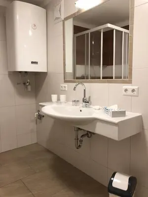 Ein Badezimmer in der Unterkunft CityApartment MELITTA
