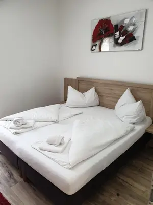 Ein Bett oder Betten in einem Zimmer der Unterkunft CityApartment MONIKA