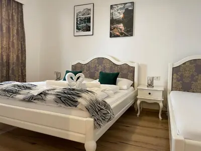 Ein Bett oder Betten in einem Zimmer der Unterkunft Dalila Appartements