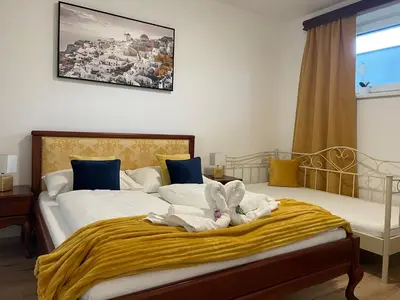 Ein Bett oder Betten in einem Zimmer der Unterkunft Dalila Appartements