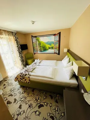 Ein Bett oder Betten in einem Zimmer der Unterkunft Hotel Pruggererhof