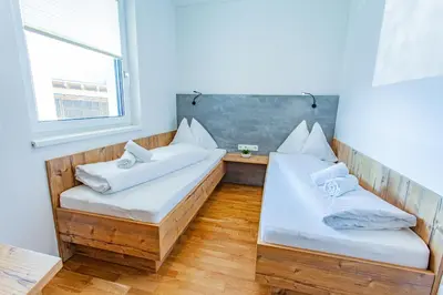 Ein Bett oder Betten in einem Zimmer der Unterkunft Happy Aich 1 by Alpenidyll Apartments