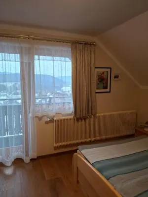 Ein Bett oder Betten in einem Zimmer der Unterkunft Fanningerwirt Holzer
