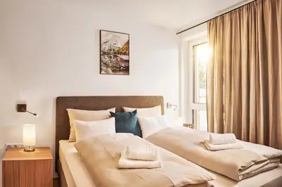 Ein Bett oder Betten in einem Zimmer der Unterkunft Adler Lodge D2 by AA Holiday Homes