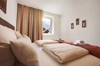 Ein Bett oder Betten in einem Zimmer der Unterkunft die Tauplitz Lodges - Alm Lodge A2 by AA Holiday Homes