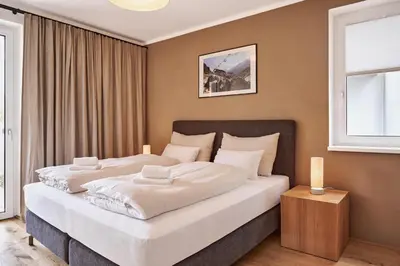Ein Bett oder Betten in einem Zimmer der Unterkunft die Tauplitz Lodges - Wasserfall Lodge C1 by AA Holiday Homes