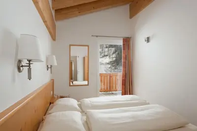 Ein Bett oder Betten in einem Zimmer der Unterkunft Obertauern-Freja-Apartment