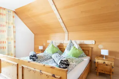 Ein Bett oder Betten in einem Zimmer der Unterkunft Chalet Taurachblick
