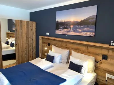 Ein Bett oder Betten in einem Zimmer der Unterkunft Die Tauplitz Lodges - Penthouse Grimming D7-1 by AA Holiday Homes