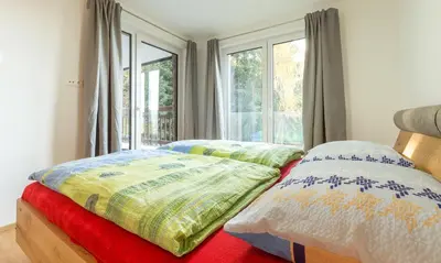 Ein Bett oder Betten in einem Zimmer der Unterkunft Ski In Ski Out Apartment Fastenberg Top 2 by AA Holiday Homes