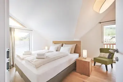Ein Bett oder Betten in einem Zimmer der Unterkunft Die Tauplitz Lodges - Bergblick B7-2 by AA Holiday Homes