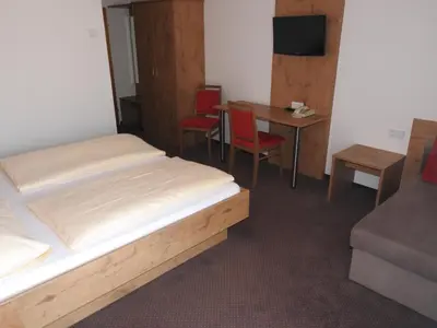 Ein Bett oder Betten in einem Zimmer der Unterkunft Hotel Carossa bed&breakfast