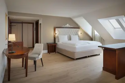 Ein Bett oder Betten in einem Zimmer der Unterkunft Arabella Jagdhof Resort am Fuschlsee, a Tribute Portfolio Hotel