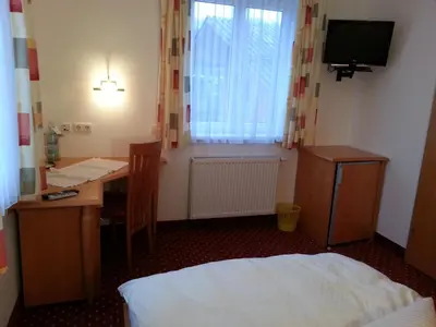 Ein Bett oder Betten in einem Zimmer der Unterkunft Gasthof Zur Post