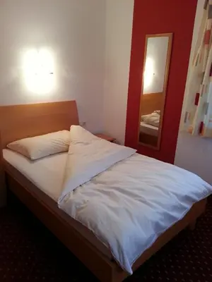 Ein Bett oder Betten in einem Zimmer der Unterkunft Gasthof Zur Post