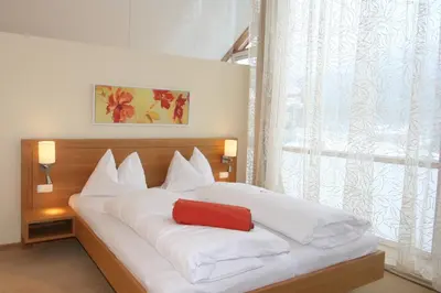 Ein Bett oder Betten in einem Zimmer der Unterkunft Hotel Hollweger