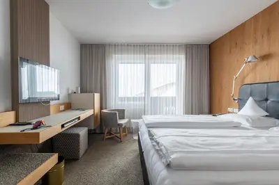Ein Bett oder Betten in einem Zimmer der Unterkunft Hotel Jakob