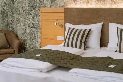 Ein Bett oder Betten in einem Zimmer der Unterkunft Hotel Auszeit St Lambrecht