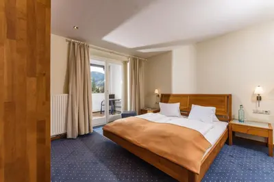 Ein Bett oder Betten in einem Zimmer der Unterkunft Aparthotel Tritscher