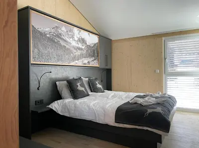 Ein Bett oder Betten in einem Zimmer der Unterkunft Familienhaus Kreischberg