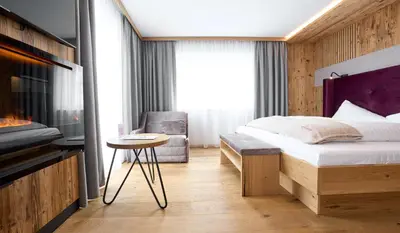 Ein Bett oder Betten in einem Zimmer der Unterkunft Hotel Gamsleiten