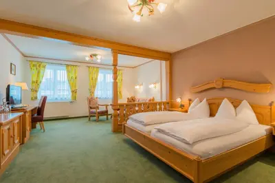 Ein Bett oder Betten in einem Zimmer der Unterkunft Posthotel Radstadt