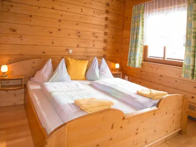 Ein Bett oder Betten in einem Zimmer der Unterkunft Cozy holiday apartment close to the slopes