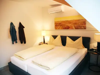 Ein Bett oder Betten in einem Zimmer der Unterkunft SEE & THE CITY apartments