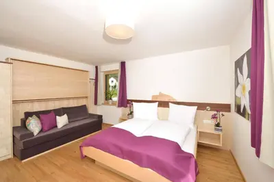 Ein Bett oder Betten in einem Zimmer der Unterkunft Appartements Kolb