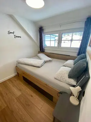 Ein Bett oder Betten in einem Zimmer der Unterkunft Das Almsternderl - gemütliche Wohnung in Gosau