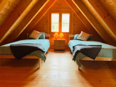 Ein Bett oder Betten in einem Zimmer der Unterkunft Zirbitz Hütte mit Sauna und Kamin