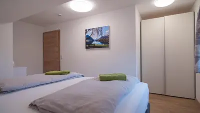 Ein Bett oder Betten in einem Zimmer der Unterkunft DAS JOHANN Apartments im Ausseerland