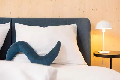 Ein Bett oder Betten in einem Zimmer der Unterkunft HIMMELBLAU - Design Apartment am Mondsee