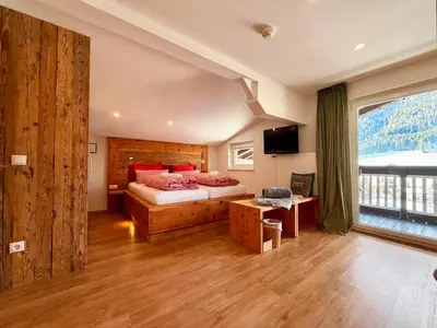Ein Bett oder Betten in einem Zimmer der Unterkunft Boutique Hotel Alpenhof