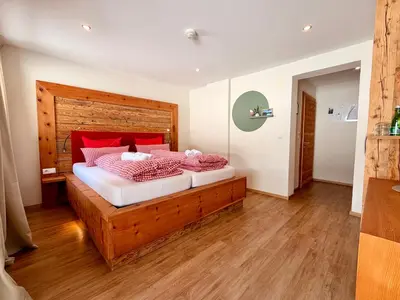 Ein Bett oder Betten in einem Zimmer der Unterkunft Boutique Hotel Alpenhof