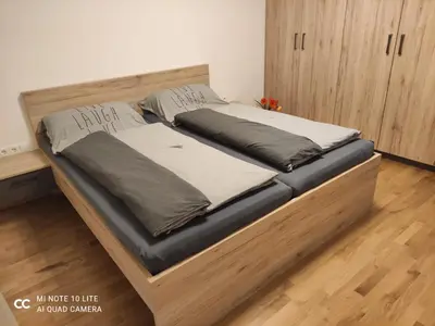 Ein Bett oder Betten in einem Zimmer der Unterkunft Sonnendorf Öblarn
