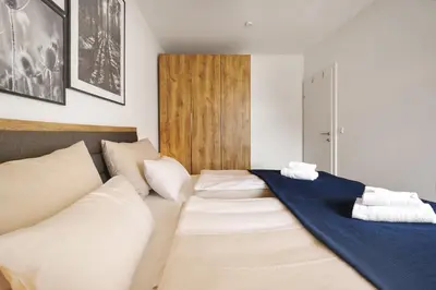 Ein Bett oder Betten in einem Zimmer der Unterkunft Adler Lodge D5