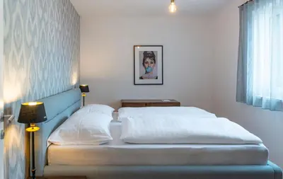 Ein Bett oder Betten in einem Zimmer der Unterkunft Apartments Traunkai Bad Ischl - Your Austrian Home