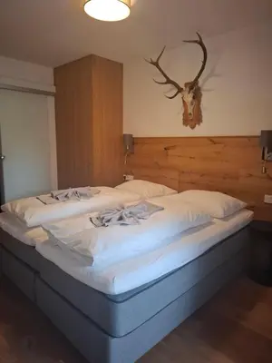 Ein Bett oder Betten in einem Zimmer der Unterkunft Deluxe Alpenkrone Schladming