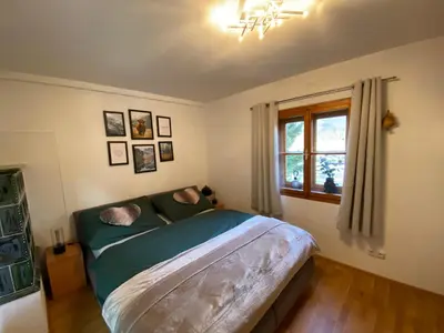 Ein Bett oder Betten in einem Zimmer der Unterkunft Sonnenhütte