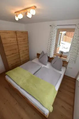 Ein Bett oder Betten in einem Zimmer der Unterkunft Ferienwohnungen Kalss nahe Altaussee