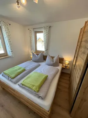 Ein Bett oder Betten in einem Zimmer der Unterkunft Ferienwohnungen Kalss nahe Altaussee