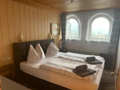Ein Bett oder Betten in einem Zimmer der Unterkunft Alpensicht
