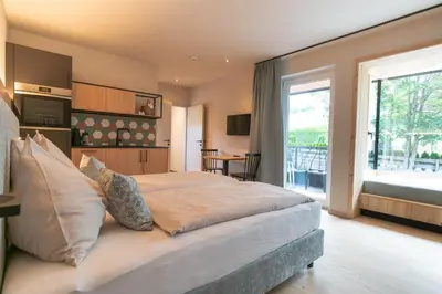 Ein Bett oder Betten in einem Zimmer der Unterkunft Apart & Suiten Hotel WEIDEN