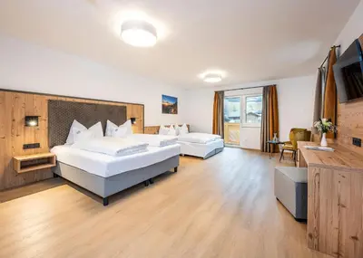 Ein Bett oder Betten in einem Zimmer der Unterkunft Hotel Brunner - Reiteralm