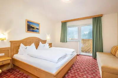 Ein Bett oder Betten in einem Zimmer der Unterkunft Hotel Brunner - Reiteralm