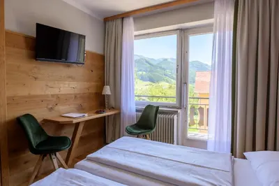Ein Bett oder Betten in einem Zimmer der Unterkunft Landgasthof Kirchenwirt
