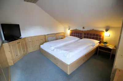 Ein Bett oder Betten in einem Zimmer der Unterkunft Landgasthof Kirchenwirt