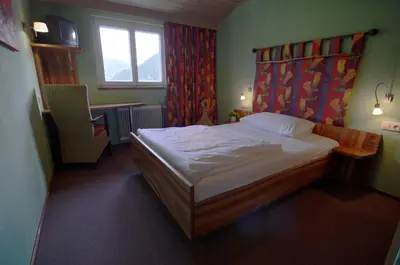 Ein Bett oder Betten in einem Zimmer der Unterkunft Landgasthof Kirchenwirt